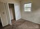 Bedroom with double door closet and carpeting at 3219 Sutton Dr, Charlotte, NC 28216