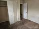 Bedroom with double door closet and carpeting at 3219 Sutton Dr, Charlotte, NC 28216