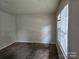 Spacious living room with neutral walls and brown carpet at 3219 Sutton Dr, Charlotte, NC 28216