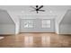 Spacious bonus room featuring hardwood floors, natural light, and ample space for entertainment at 357 Magnolia St, Davidson, NC 28036