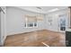 Bright dining area with large windows, wood floors, and modern chandelier at 357 Magnolia St, Davidson, NC 28036