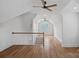 Upstairs hallway featuring hardwood floors and a white banister at 357 Magnolia St, Davidson, NC 28036