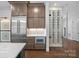 Close up of kitchen featuring custom cabinets and a stainless steel refrigerator at 357 Magnolia St, Davidson, NC 28036