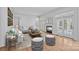 Cozy living room featuring a fireplace, comfortable seating, and natural light, perfect for relaxation at 357 Magnolia St, Davidson, NC 28036