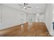 Open-concept living room with hardwood floors and backyard access at 357 Magnolia St, Davidson, NC 28036