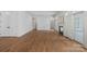 A bright and airy room featuring hardwood floors, neutral walls, a fireplace, and abundant natural light at 357 Magnolia St, Davidson, NC 28036