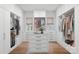 Organized walk-in closet with custom shelving, drawers, and a central island for storage at 357 Magnolia St, Davidson, NC 28036