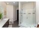 Modern bathroom with glass shower and sleek gray cabinets at 3630 N Davidson St # 4406, Charlotte, NC 28205