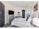 Inviting bedroom featuring neutral decor, comfortable bedding, and a view outside at 3630 N Davidson St # 4406, Charlotte, NC 28205