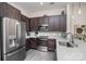 Modern kitchen featuring stainless steel appliances, gray cabinets, and quartz countertops at 3630 N Davidson St # 4406, Charlotte, NC 28205