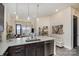 Bright kitchen with white countertops, stainless steel appliances and a view to the living room at 3630 N Davidson St # 4406, Charlotte, NC 28205