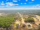 An aerial view of a residential area with tree coverage and cloudy skies at 4011 Brandy Creek Ct, Clover, SC 29710