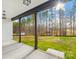 A covered patio with a view of the property's expansive backyard, featuring lush green grass at 4011 Brandy Creek Ct, Clover, SC 29710