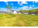 Expansive backyard featuring a well-manicured lawn and mature trees at 4011 Brandy Creek Ct, Clover, SC 29710