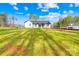 Large backyard with lush green lawn and a spacious area for outdoor activities at 4011 Brandy Creek Ct, Clover, SC 29710