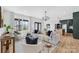 Bright and airy living room featuring hardwood floors, stylish seating, and an open concept design at 4011 Brandy Creek Ct, Clover, SC 29710