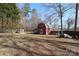 Large backyard with red barn and chicken coop at 416 Delview Dr, Cherryville, NC 28021