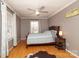 Bright bedroom with hardwood floors and ceiling fan at 416 Delview Dr, Cherryville, NC 28021