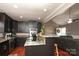 Modern kitchen with dark cabinetry, granite island, and stainless steel appliances at 416 Delview Dr, Cherryville, NC 28021