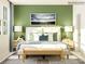 Relaxing bedroom with green walls and a wood bench at 4491 Potters Wheel Dr, Fort Mill, SC 29715