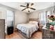 Comfortable bedroom with hardwood floors, a ceiling fan, and natural light at 453 Bynum Ave, Rock Hill, SC 29732