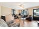 Bright living room featuring hardwood floors, a ceiling fan, and comfortable seating with lots of natural light at 453 Bynum Ave, Rock Hill, SC 29732