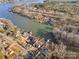 Aerial view shows home's location on a tranquil lake at 513 Paradise Cir, Belmont, NC 28012