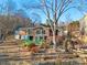 Charming backyard with lush landscaping and seating area at 513 Paradise Cir, Belmont, NC 28012