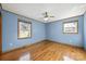 Light blue walls, hardwood floors, and two windows at 513 Paradise Cir, Belmont, NC 28012