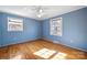 Hardwood floors, light blue walls, and two windows at 513 Paradise Cir, Belmont, NC 28012