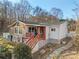 Ranch home features a large sunroom and deck at 513 Paradise Cir, Belmont, NC 28012