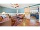 Living room features hardwood floors, a barn door to the kitchen, and comfortable seating at 513 Paradise Cir, Belmont, NC 28012