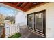 Private patio with double doors and white picket fence at 513 Paradise Cir, Belmont, NC 28012