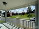 Front porch view of a landscaped yard and neighborhood at 516 Washington St, Cramerton, NC 28032