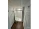 Basement shower with glass enclosure, tiled walls, and wood-paneled accent wall at 516 Washington St, Cramerton, NC 28032