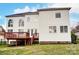 Two story home showcasing the back exterior, deck and spacious backyard at 561 Ambergate Nw Pl, Concord, NC 28027