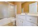 Bathroom with tub and shower, and a white vanity and plenty of cabinet space at 561 Ambergate Nw Pl, Concord, NC 28027