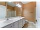 Bathroom featuring a double sink vanity, large mirror, and separate shower at 561 Ambergate Nw Pl, Concord, NC 28027