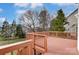 Outdoor deck overlooking the backyard and surrounding landscape at 561 Ambergate Nw Pl, Concord, NC 28027