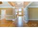 Bright and airy foyer with gleaming hardwood floors, detailed trim and an open floor plan at 561 Ambergate Nw Pl, Concord, NC 28027