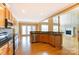 Modern kitchen area features granite countertops and stainless steel appliances, open floor plan at 561 Ambergate Nw Pl, Concord, NC 28027