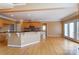 Open kitchen design featuring a kitchen island with granite countertops and wooden cabinets at 561 Ambergate Nw Pl, Concord, NC 28027