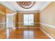 Spacious living room with decorative ceiling, hardwood flooring, and great natural light at 561 Ambergate Nw Pl, Concord, NC 28027