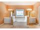 Bright main bathroom featuring a large soaking tub with tile flooring and large vanity at 561 Ambergate Nw Pl, Concord, NC 28027