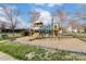 Outdoor playground featuring a slide and climbing structures, surrounded by trees and grass at 561 Ambergate Nw Pl, Concord, NC 28027