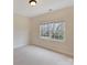 Bright bedroom featuring a double window that lets in natural light and white carpet flooring at 6042 Legacy Cir, Charlotte, NC 28277