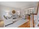 Bright living room featuring hardwood floors, and stylish furniture, creating a comfortable and inviting space at 6042 Legacy Cir, Charlotte, NC 28277