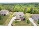 Aerial view of two-story brick home with large lot, fenced backyard, and mature trees at 6361 Willow Farm Dr, Denver, NC 28037
