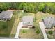 An aerial view of a two-story home on a well manicured lot with mature trees in background at 6361 Willow Farm Dr, Denver, NC 28037