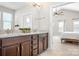 Modern bathroom with double vanity, granite countertop, and access to bedroom at 6361 Willow Farm Dr, Denver, NC 28037